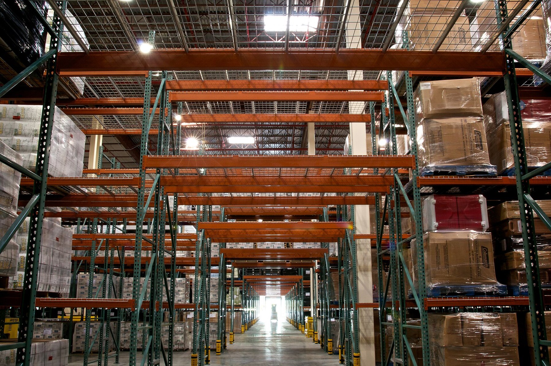 Shelving and cartons in a distribution center